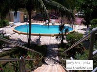 View of the pool and parking of the Apart-Hotel BRUNO HOTEL - Boca Chica - Dominican Republic